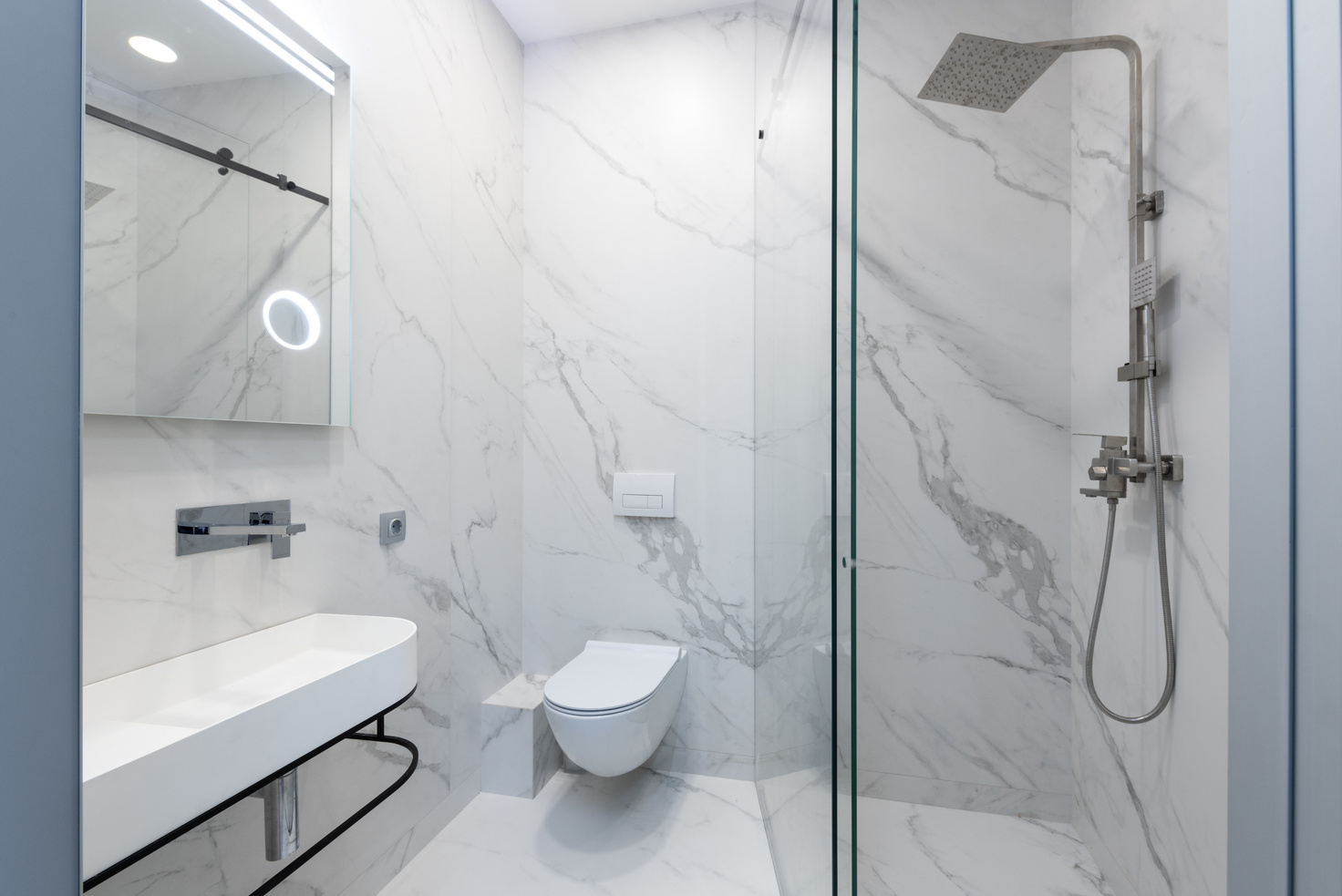 A Toilet with Stainless Steel Shower